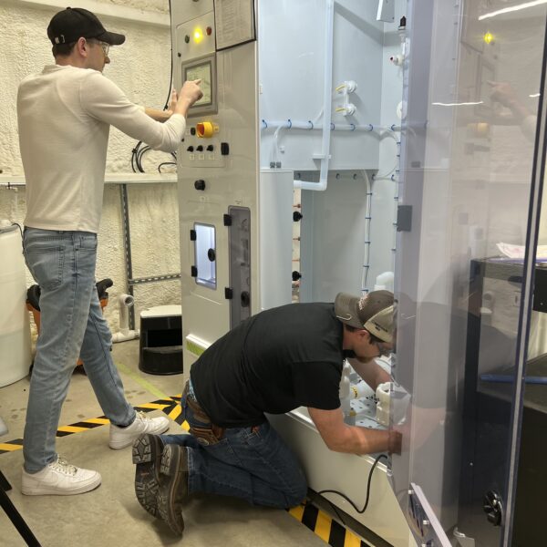two men repairing